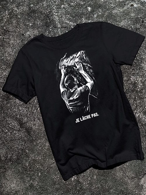 T-shirt escalade Je lâche pas, à plat, sur un rocher
